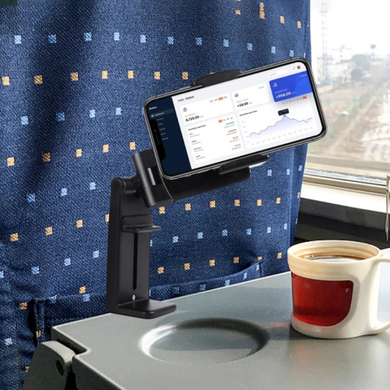 Black adjustable phone holder clamped on a train table holding a smartphone horizontally