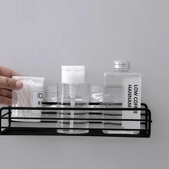 Black Adhesive Metal Wall-Mounted Storage Shelf Black metal adhesive wall-mounted storage shelf holding clear bottles and cotton swabs on gray wall