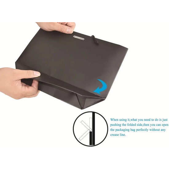 Black Paper Gift Bag with Folded Bottom Opening Black paper gift bag being opened by pushing the folded bottom side to avoid creases