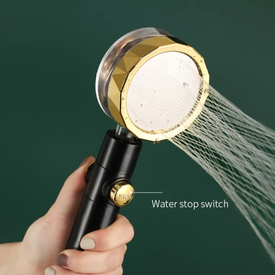 Shower Head with Water Filter and Pressure Boost, Water Stop Button Black shower head with gold ring and water stop button spraying multiple fine water streams