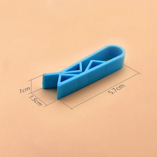 Blue plastic clip with triangular supports designed to secure trash bags and prevent slipping