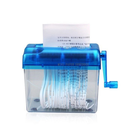 Mini paper shredder with blue top and clear container shredding white paper into vertical strips