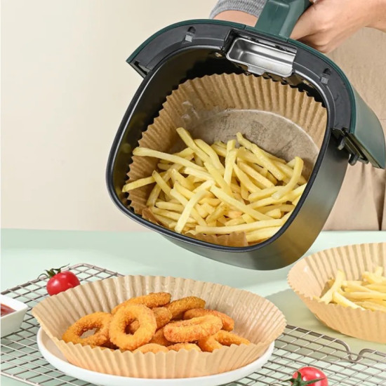 Brown ridged nonstick air fryer paper liners holding fried onion rings and French fries