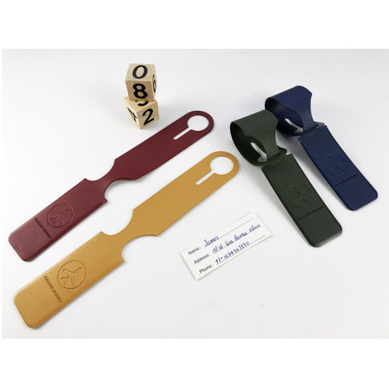 Colorful leather luggage tags with embossed airplane symbol and slot for attaching to bags