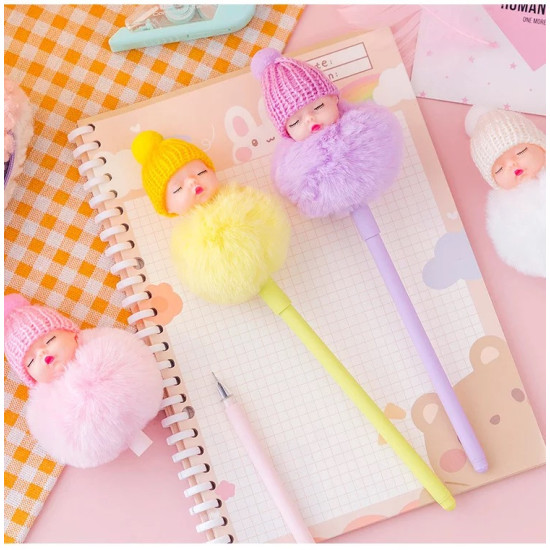 Fluffy Doll Head Colored Pens with Knitted Hats for School and Office Colorful fluffy doll head pens with closed eyes wearing knitted hats and matching pompom bodies on a notebook