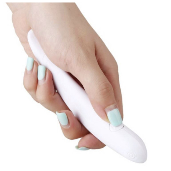 Hand holding a white curved pen for decorating coffee and cake with a small oval button