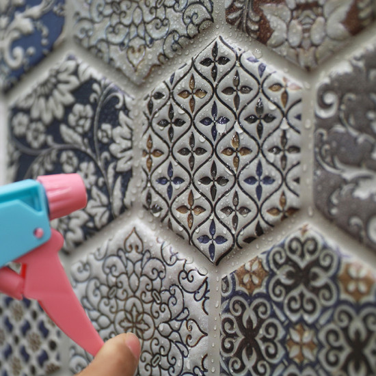 Hexagonal 3D self-adhesive foam wall decor with intricate blue and brown floral patterns and water droplets