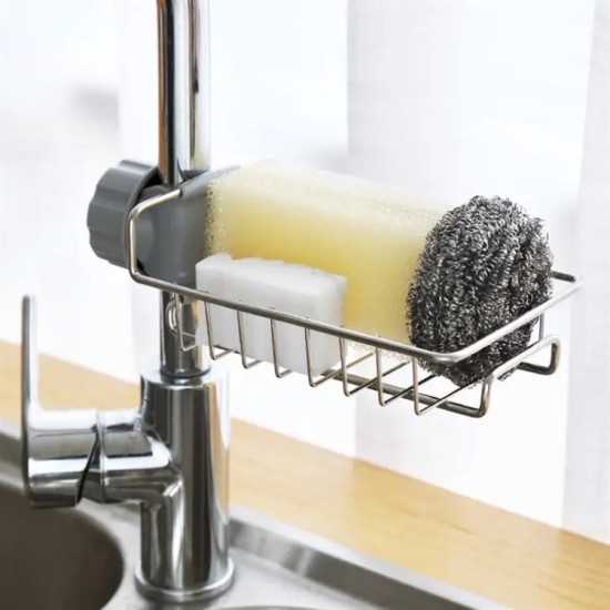 metal wire basket holder attached to kitchen faucet holding sponge, soap bar, and steel scrubber