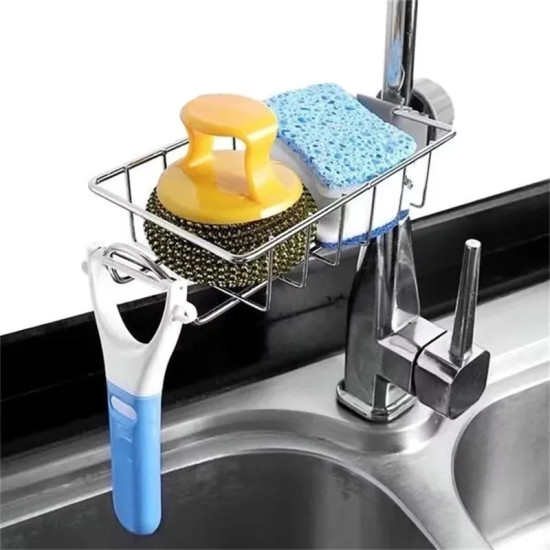 metal wire basket on kitchen faucet holding a blue sponge, yellow scrubber, and hanging white-blue peeler