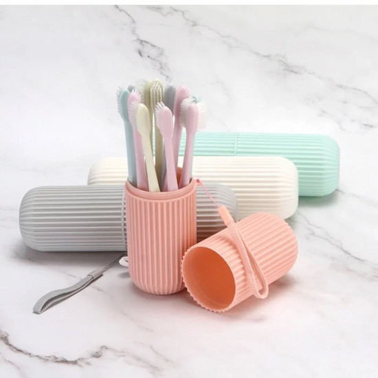 Pastel ribbed cylindrical container open with multiple toothbrushes inside and a detachable lid with wrist strap