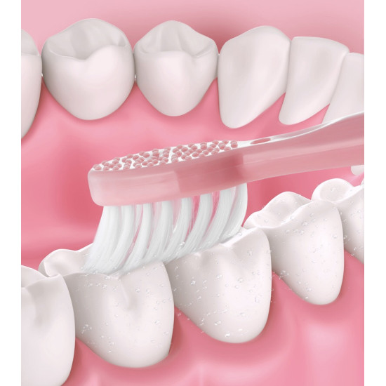 Pink battery-powered electric toothbrush with soft white bristles cleaning teeth closely