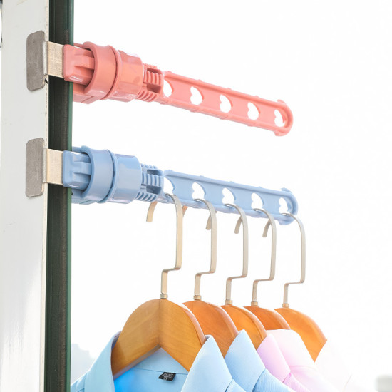 Portable Extendable Door Hooks with Wooden Hangers Two extendable hooks mounted on a door edge, one pink and one blue. Each hook arm has five heart-shaped holes. The blue hook holds five wooden hangers with shirts in blue, pink, and white colors. The pink hook is empty.