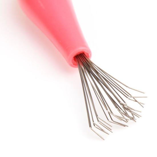 Pink handle tool with multiple thin metal wires bent at ends for removing hair from combs and brushes