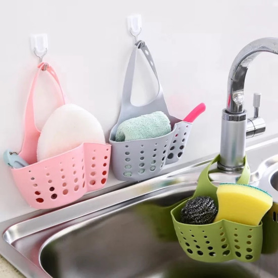 Pink, gray, and green silicone holders with multiple holes hanging in kitchen and bathroom holding sponges and towels