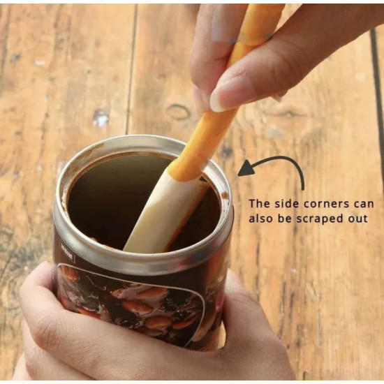 Silicone spatula with a long handle scraping contents from inside a metal jar reaching side corners