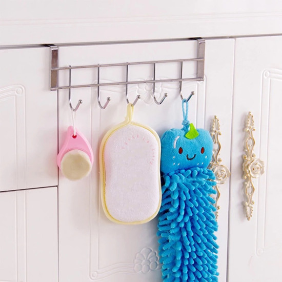 Silver metal door hanger with five hooks holding bath sponges and a soft brush