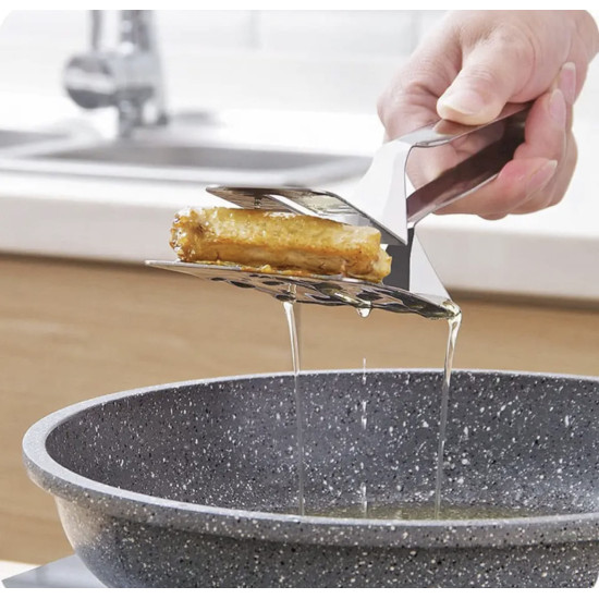 3-in-1 Stainless Steel Cooking Tongs for Flipping, Frying, and Serving Hand holding stainless steel cooking tongs draining oil from fried food over a frying pan