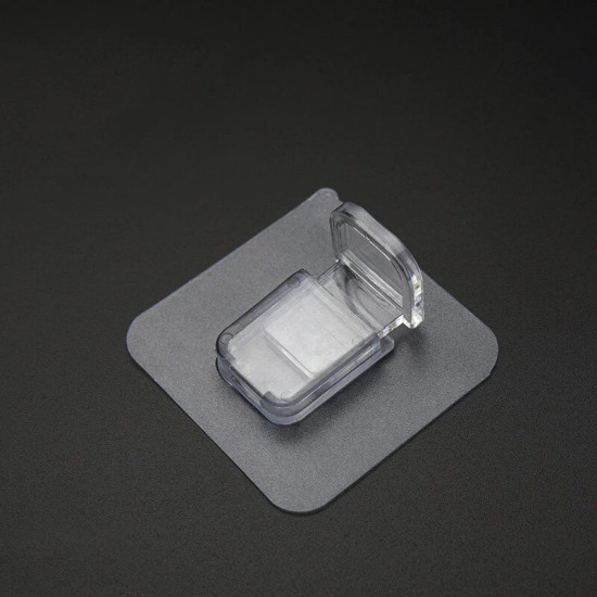 Transparent adhesive shelf support bracket with a hinged clip on a square adhesive base