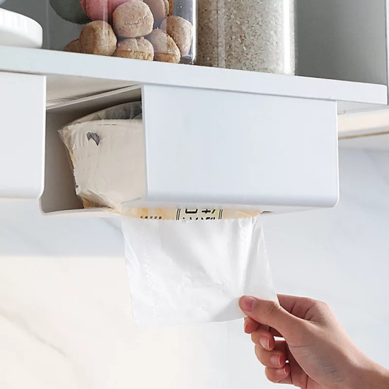 White Adhesive Multiuse Tissue Dispenser for Walls and Desks White adhesive tissue dispenser mounted under shelf with a hand pulling a tissue