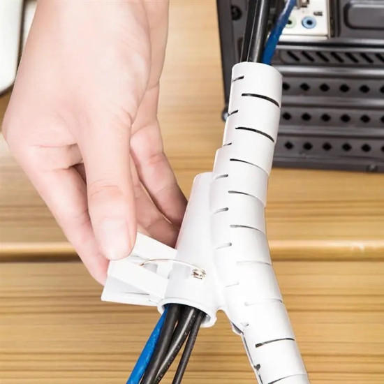 Flexible Cable Organizer with Protective Sleeve and Clip White flexible cable protector with spiral cuts securing black and blue cables using a plastic clip