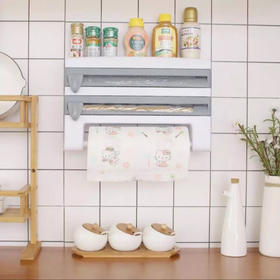 White kitchen wrap organizer with two horizontal levers and a paper towel roll holder below, mounted on tiled wall