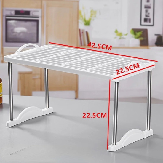 White plastic grid kitchen organizer with metal legs and curved supports for countertop storage