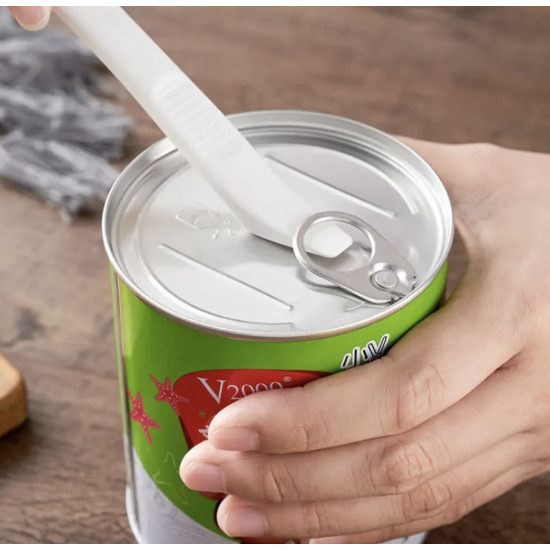 White silicone spatula used to open a metal can with a pull tab