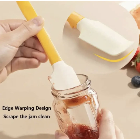 Yellow handle white silicone spatula scraping jam from inside a glass jar with a warped edge design