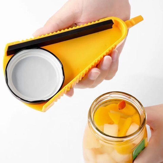 Yellow Triangular Jar Lid Opener with Ridged Edges Yellow triangular jar lid opener with ridged edges gripping a white jar lid